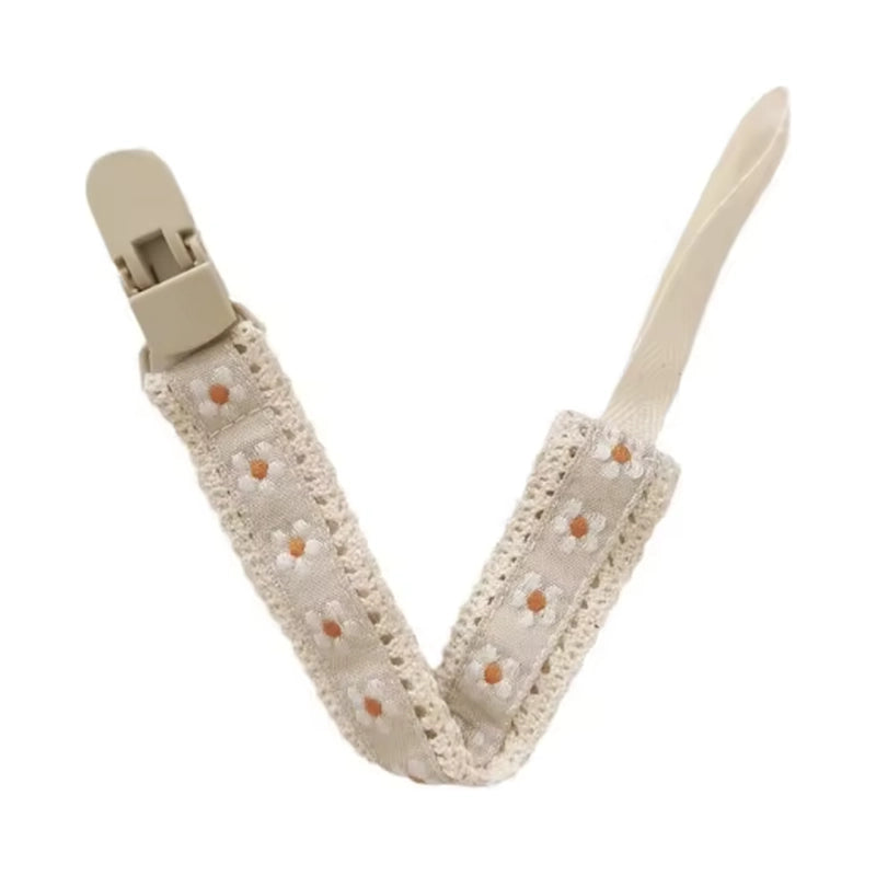 Attache tétine en tissu beige, motif petites fleurs blanches