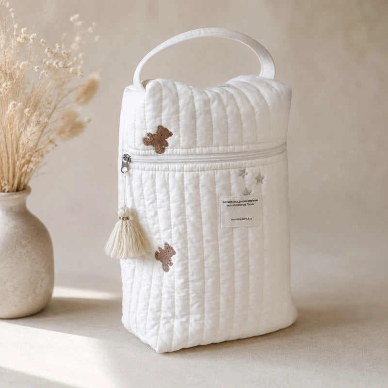 Sac à couche bébé blanc matelassé motif étoiles avec pompon décoratif