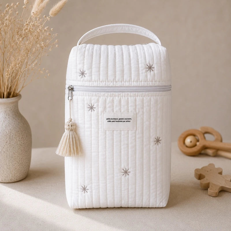 Sac à couche bébé matelassé blanc vue de profil avec anse de transport