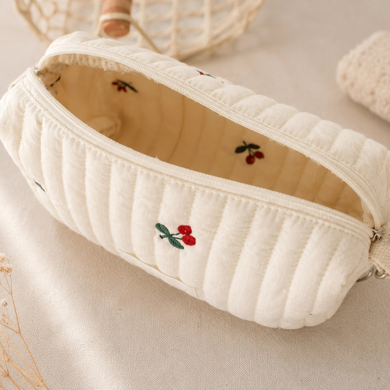 Trousse de toilette bébé matelassée écrue brodée citrons, avec dragonne amovible